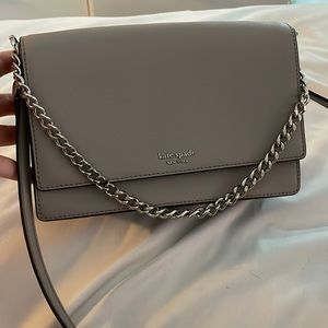 Gray medium size crossbody. Gently used. With silver chain. Kate spade